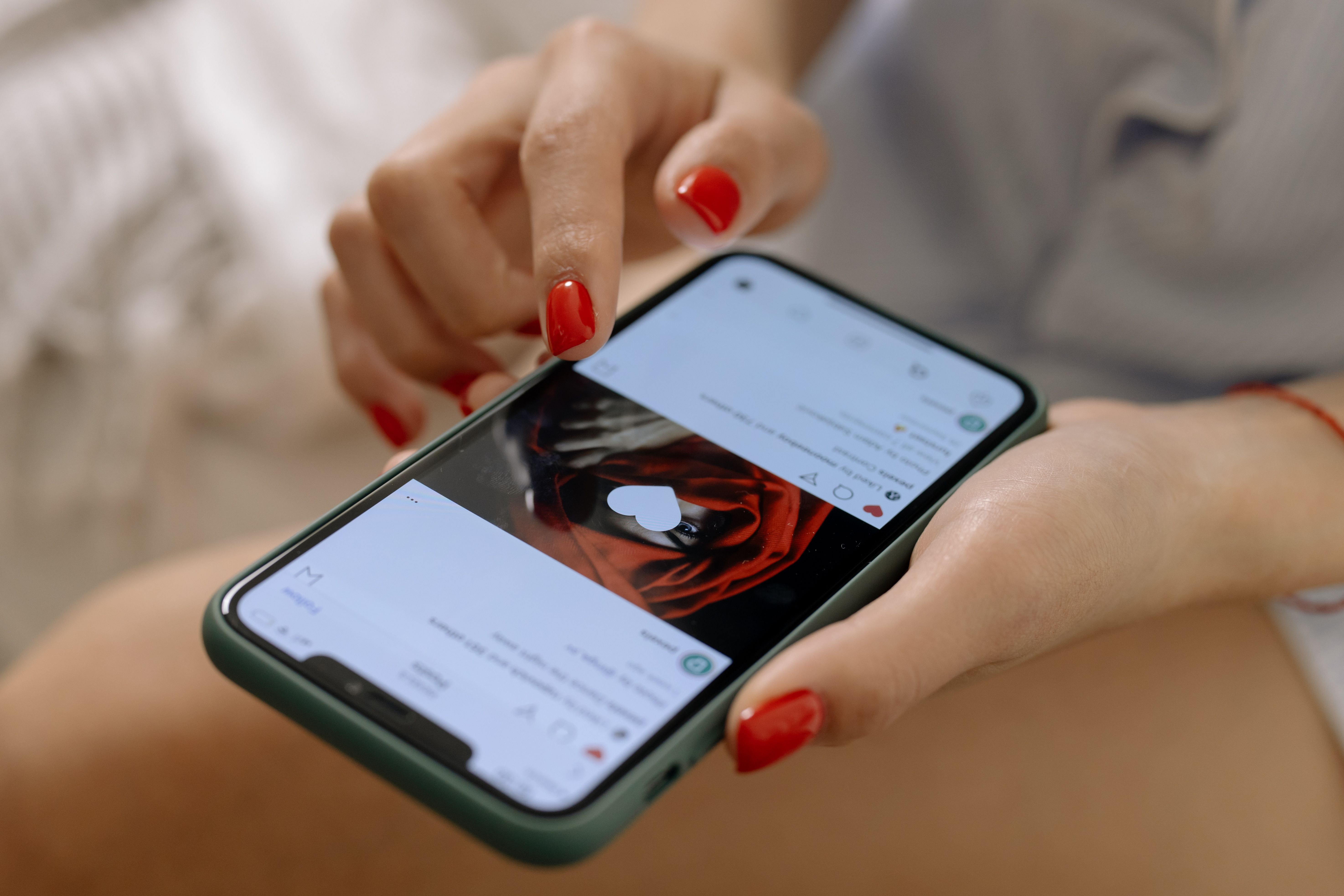 A person scrolling past ads on social media — the cold traffic every campaign has to earn attention from