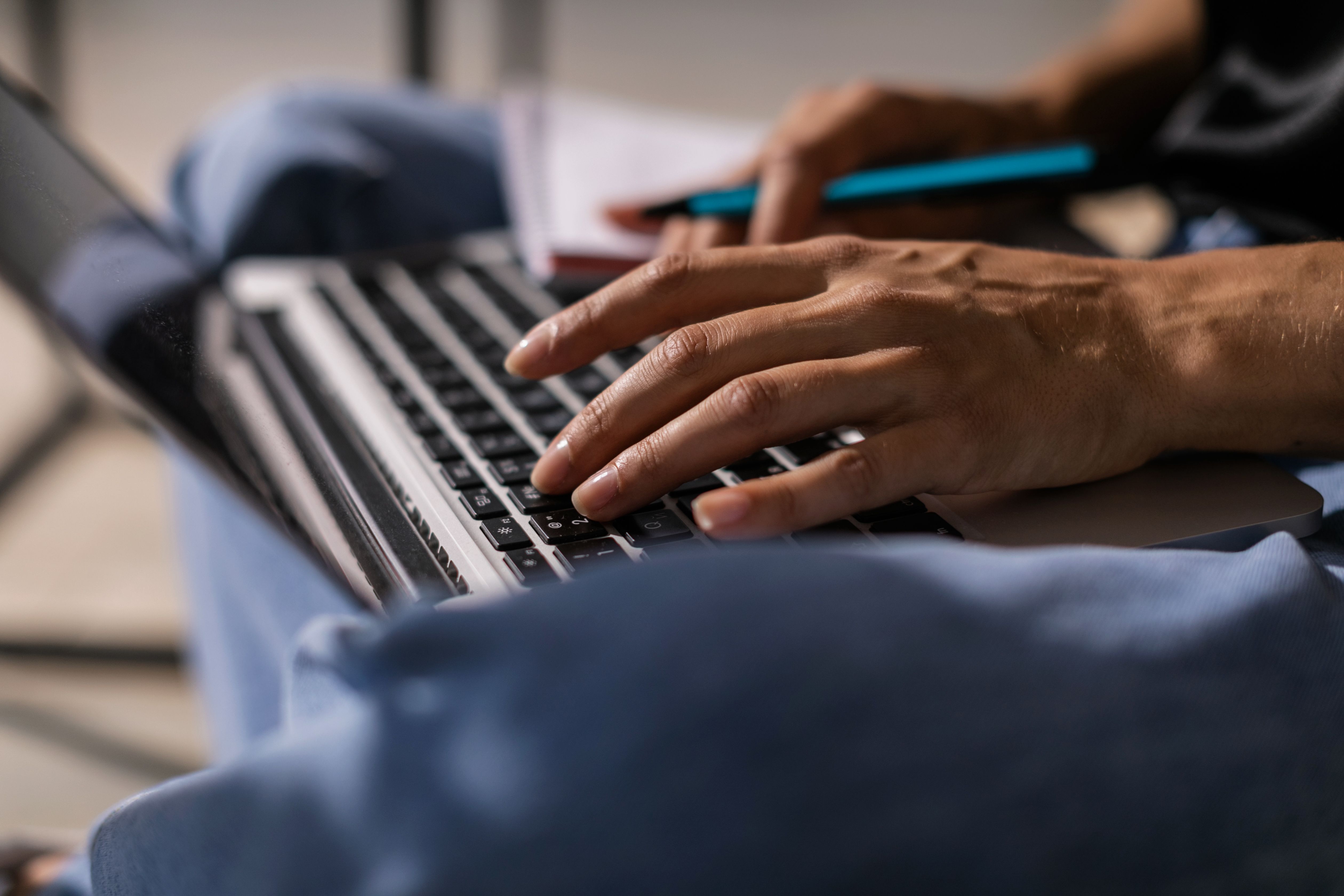 A woman working on a laptop, representing the research and writing behind real content marketing services