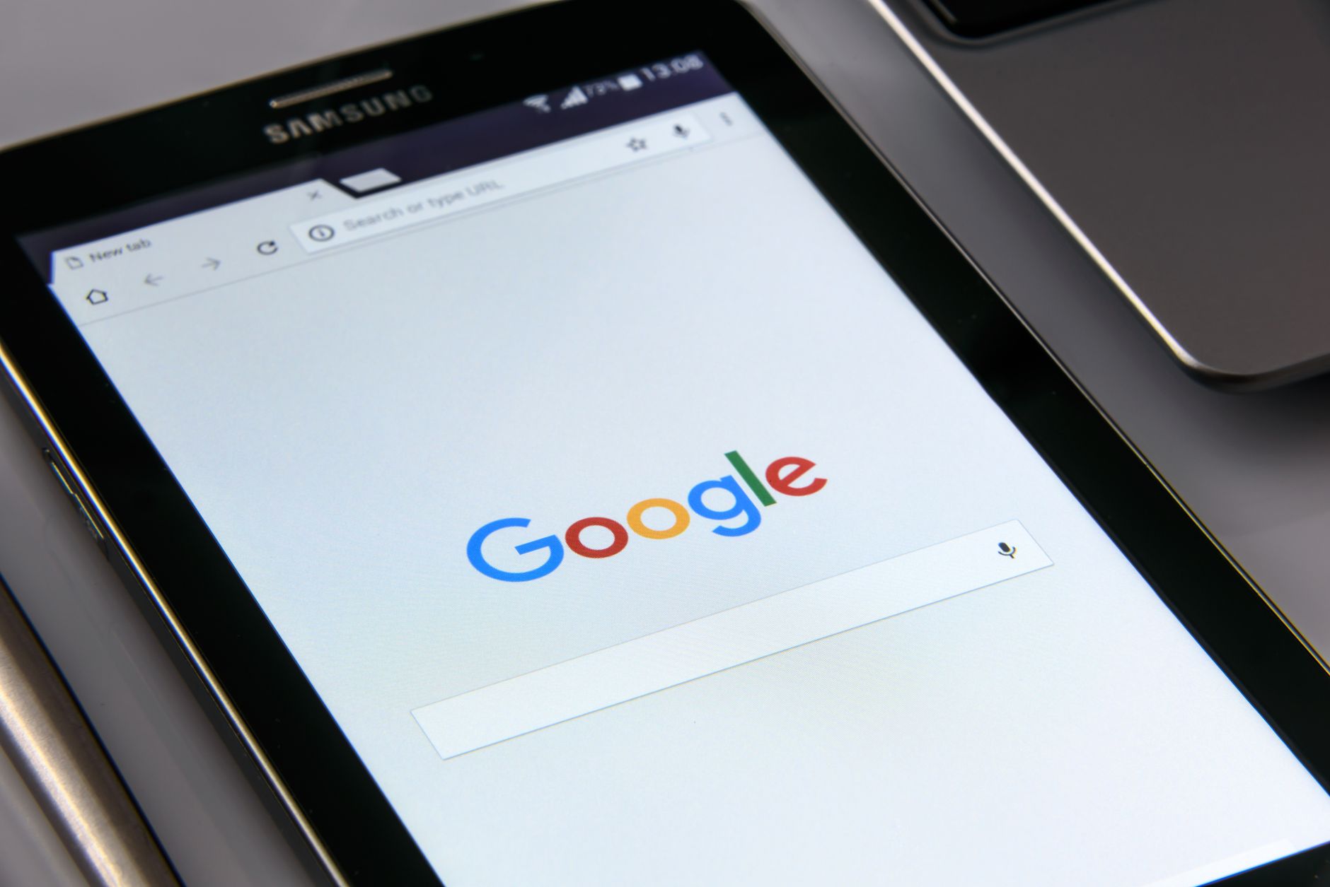 A tablet showing the Google search page, where Google ads reach people already searching