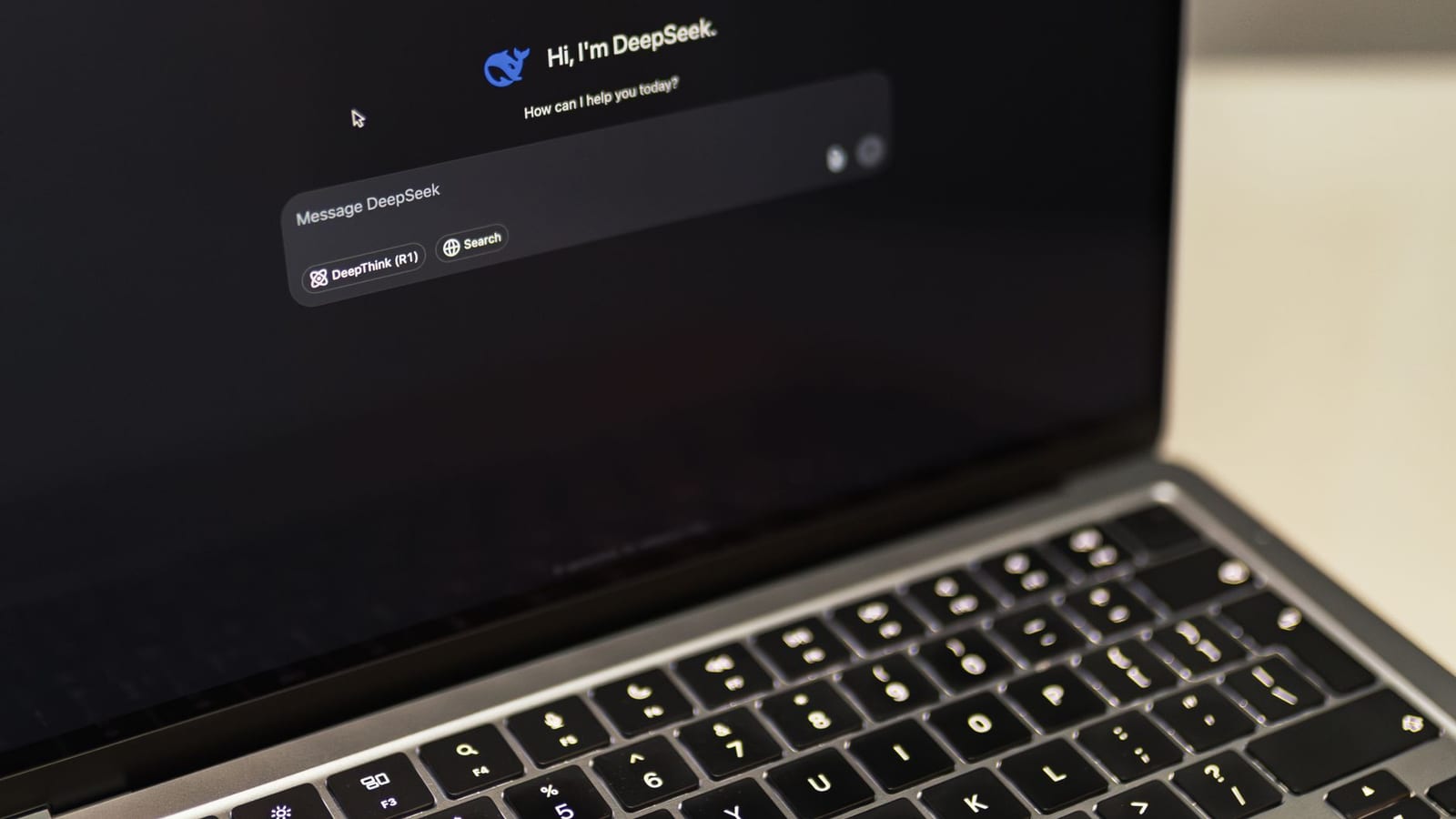 An AI chat assistant open on a laptop screen, its empty message box waiting for a question