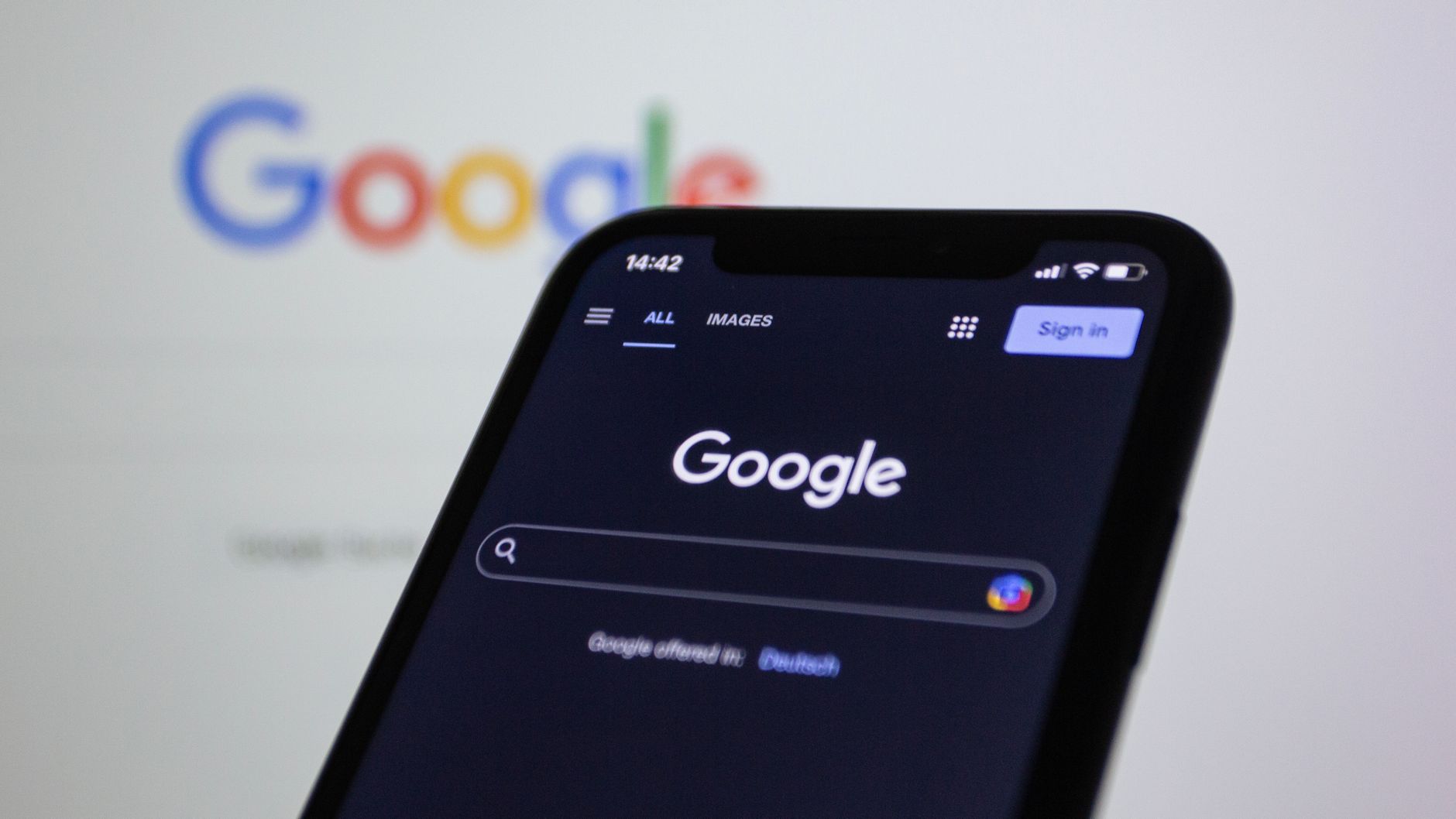 A smartphone showing the Google search screen, the way most visitors reach a landing page