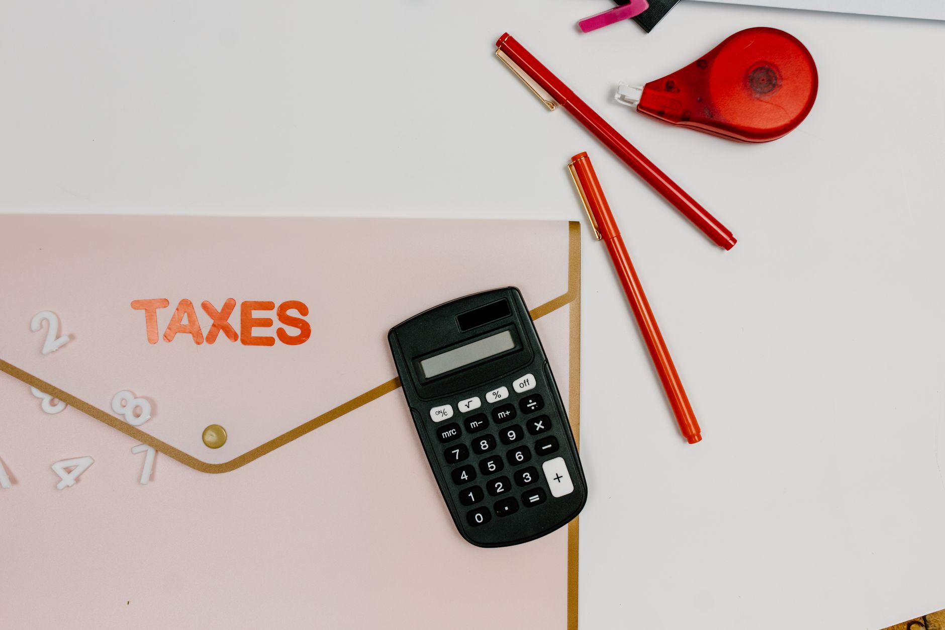 A calculator beside tax documents on a desk, the kind of specific, service-level content a Thunder Bay accounting firm needs to rank for local searches