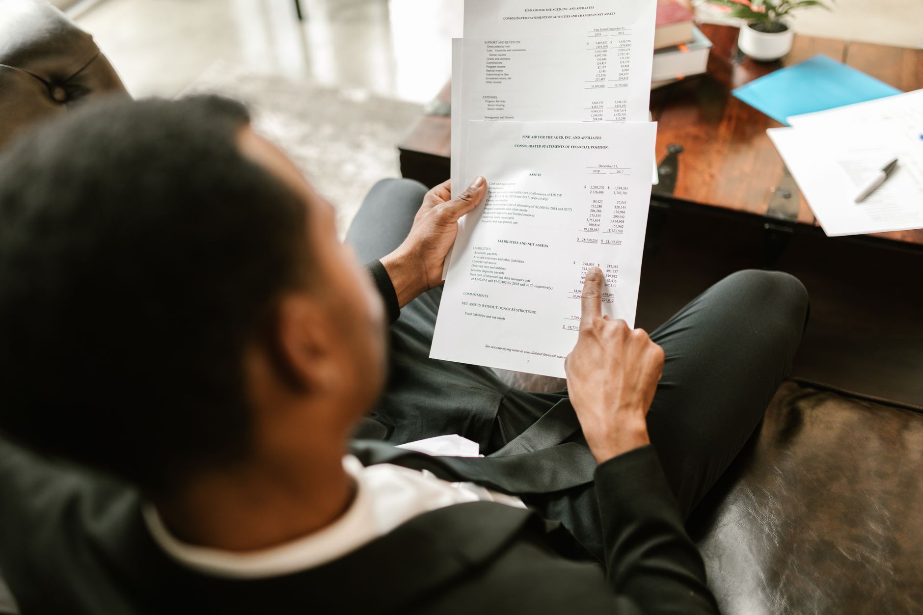 An accountant pointing out figures on a document at a desk, local SEO for accountants in Thunder Bay starts with a firm new clients can actually find online