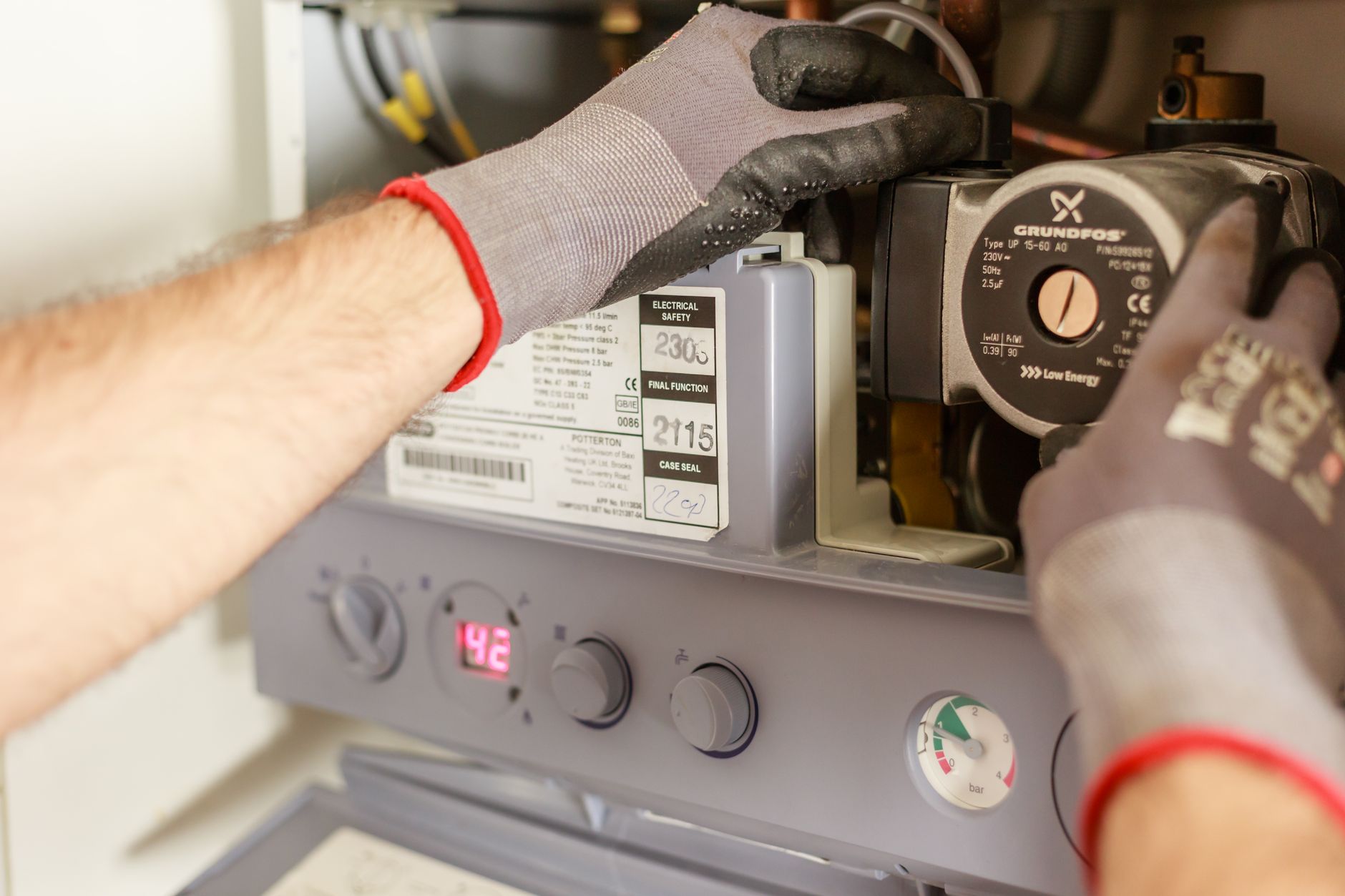 An HVAC technician repairing a power source on a furnace, local SEO for HVAC companies in Richmond Hill starts with a crew homeowners can actually find