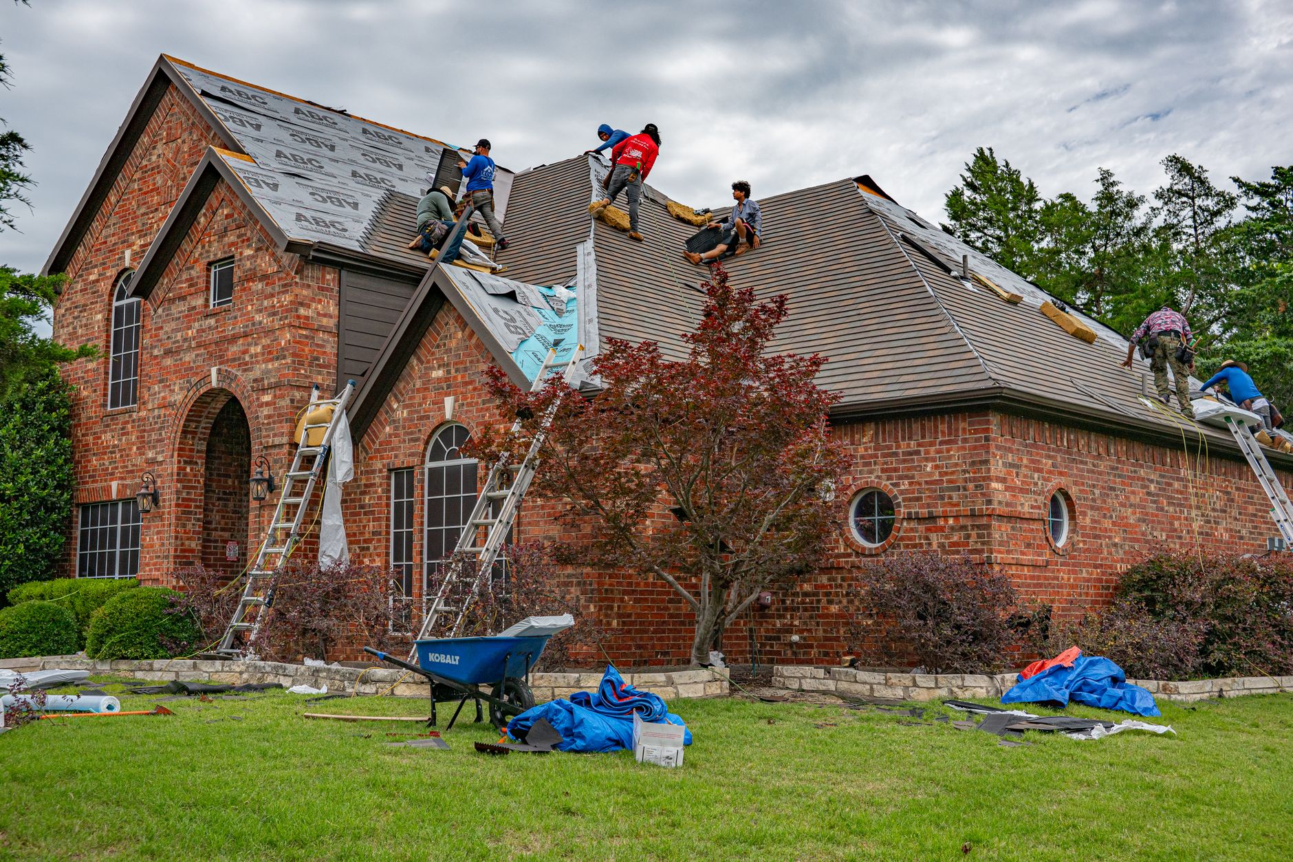 Roofing crew renovating a shingle roof, the kind of real local work local SEO for roofers in Innisfil is built to showcase