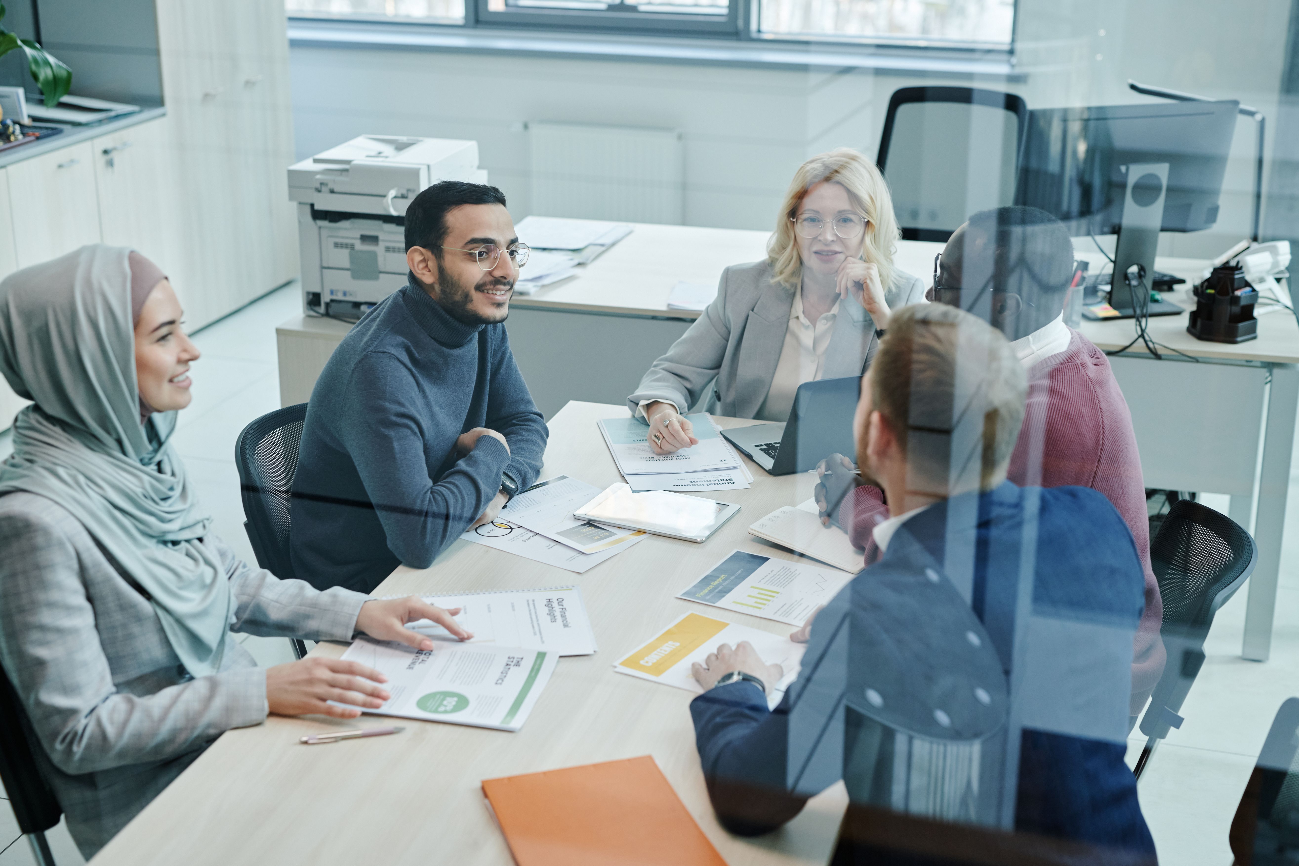 marketing team reviewing content strategy on a whiteboard